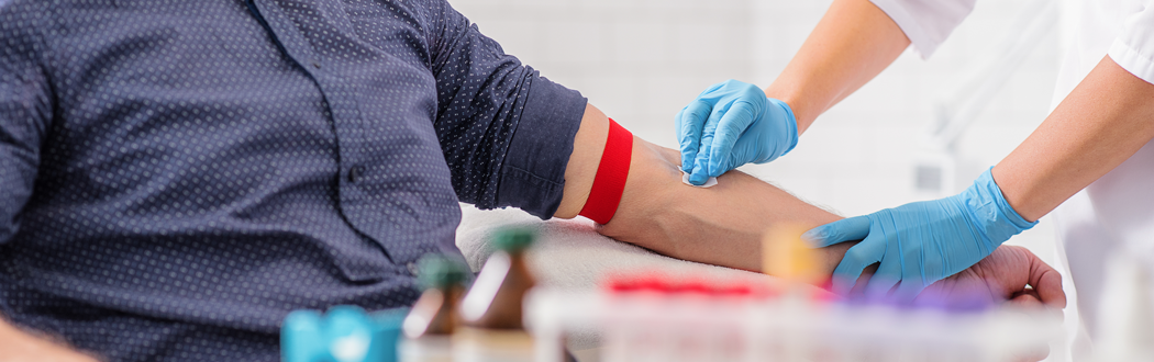 man getting blood drawn in lab