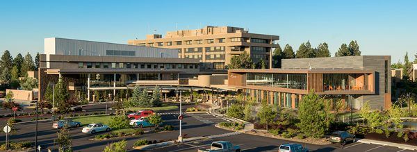 large hospital campus with brick and wood buildings