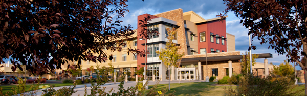 tan, red and grey three story building