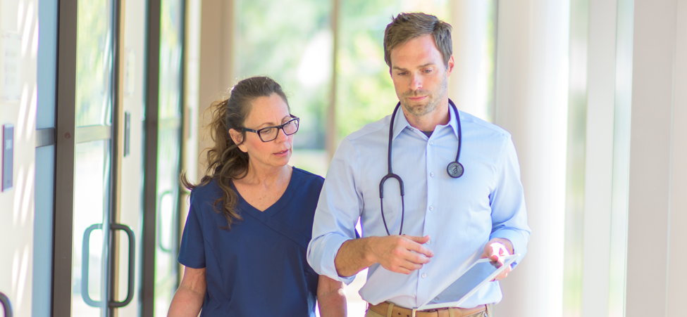 two doctors walking down hallway