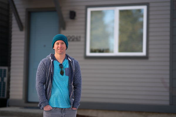 St. Charles caregiver Jake Fries in front of his new home in Bend