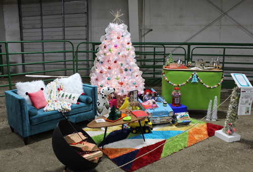 Hospice Auction in Prineville - pink Christmas tree with a living room scene