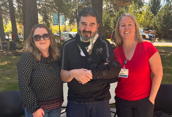 Richard Macias, center, and his wife Sherry were excited to attend Trauma Survivor Day at St. Charles so Macias could thank the caregivers, including Dr. Marika Gassner, pictured right, who helped provide him care during his long recovery after falling from a roof late last year. 