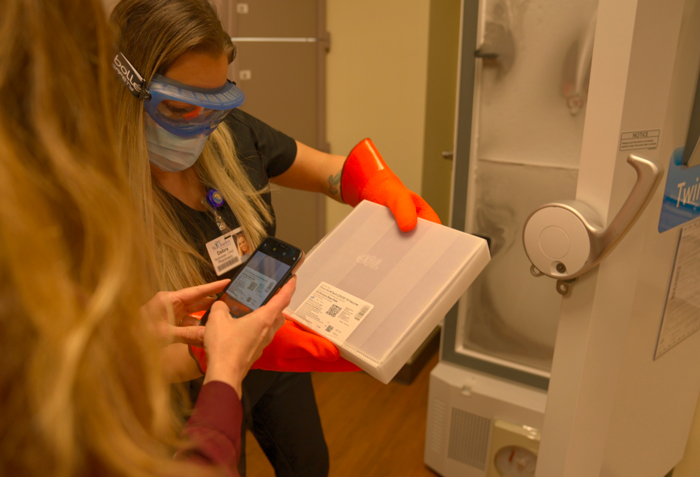 COVID Vaccine arrives and is being placed in freezer