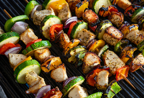 chicken kabobs on a grill