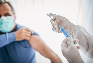 man getting injection in arm