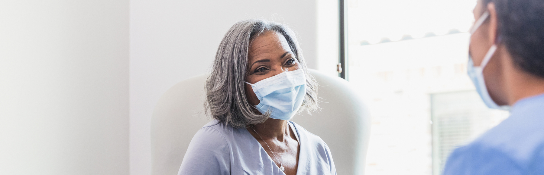 Woman patient talking to medical professional